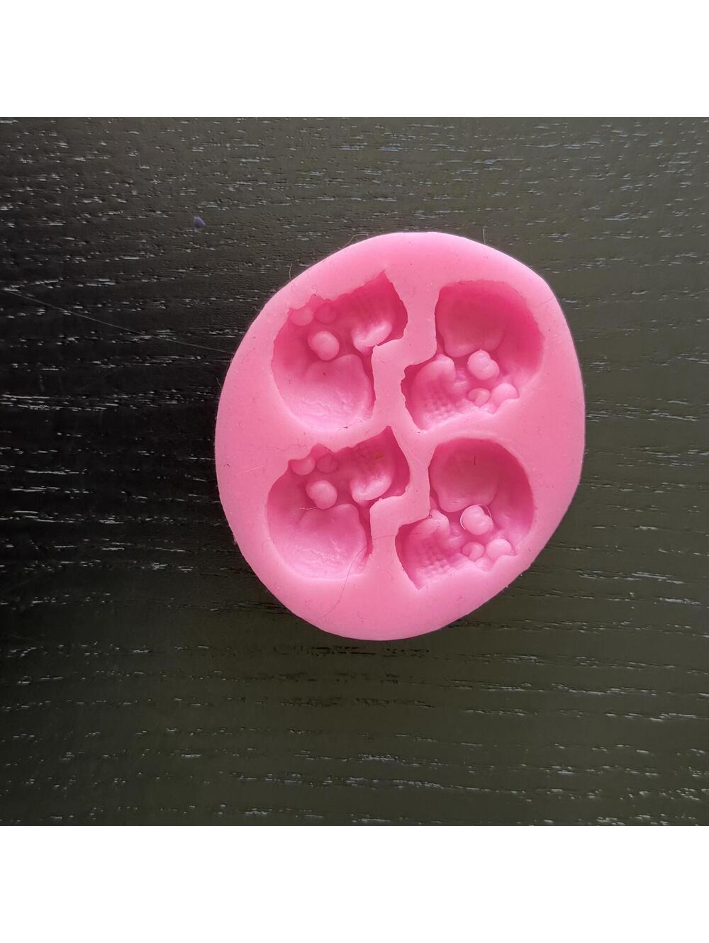Pink Silicone Mold with Four Skull Cavities